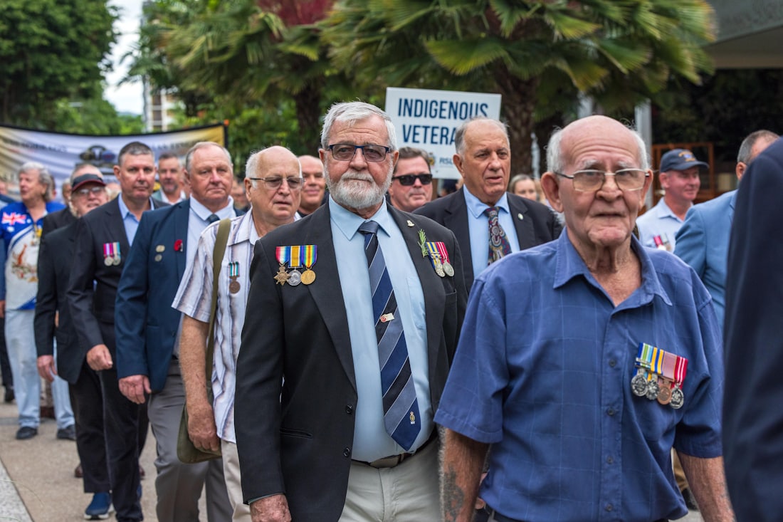 Veterans marching together in solidarity at a commemorative event