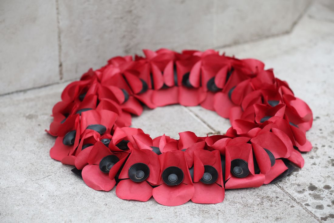 A red poppy wreath laid in remembrance